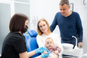Parents talking to a pediatric dentist
